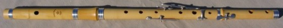[photo of a 5-key european boxwood Irish flute with tuning slide and silver rings]